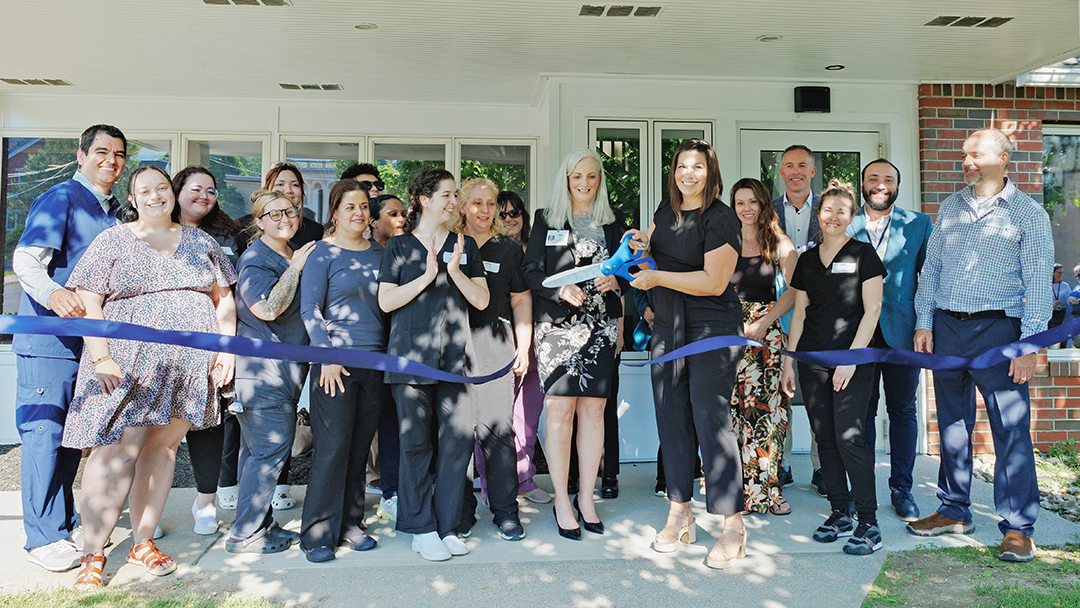 Practice Manager, Nicole Wilkinson, officially opens the Adams Family Dental practice.